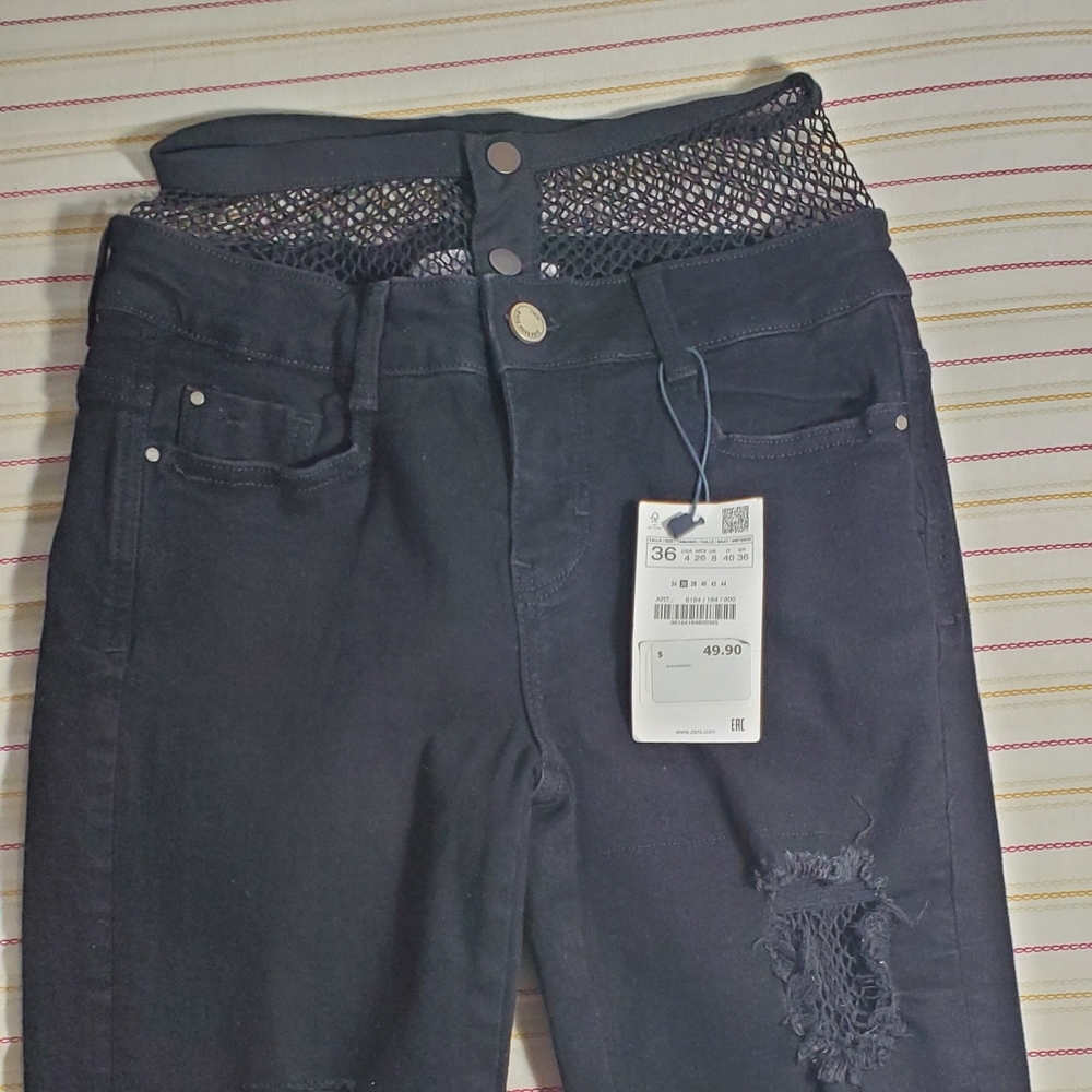 High-waisted fishnet jeans